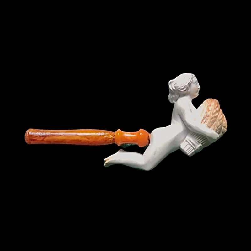 A sea foam pipe featuring an erotic design of a nude woman.