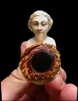 A sea foam pipe featuring an erotic design of a nude woman.