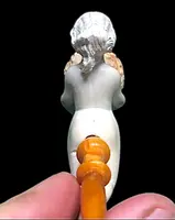A sea foam pipe featuring an erotic design of a nude woman.