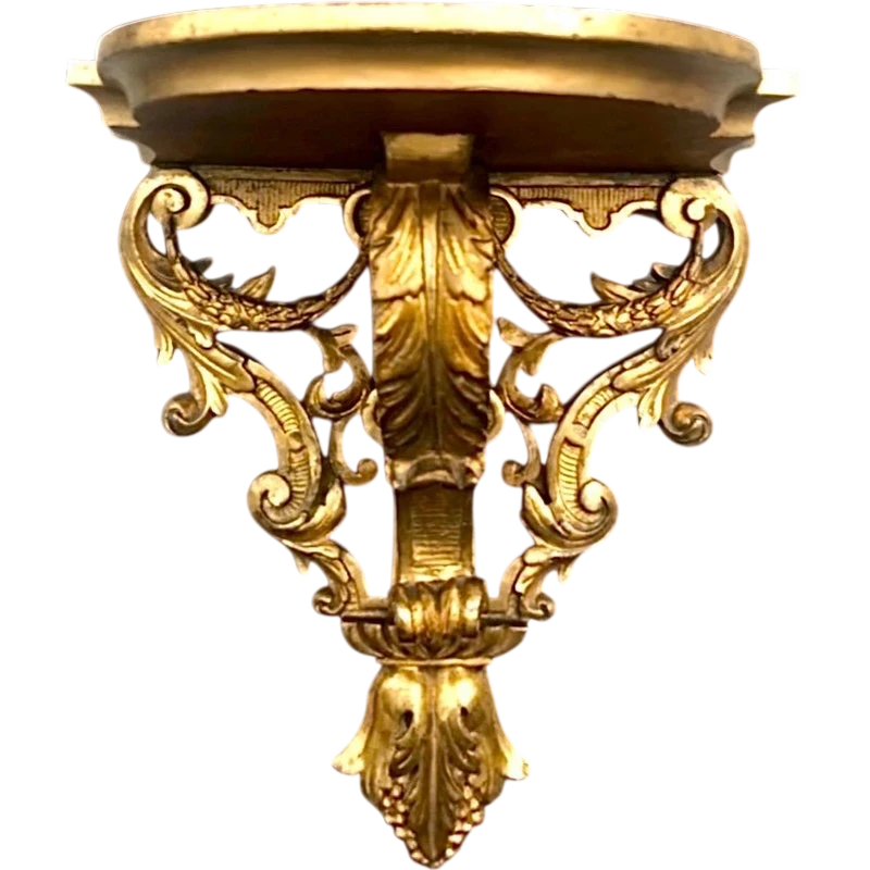Mensola in legno e foglia oro con festoni ,volute rocaille e motivi vegetali stilizzati.