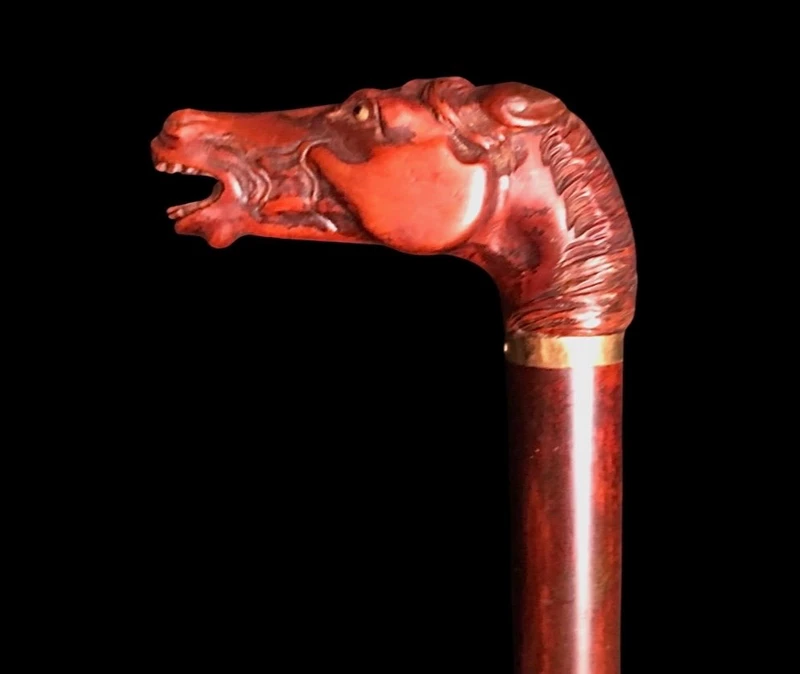 Walking stick with a boxwood knob shaped like a horse's head.