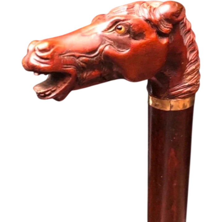 Walking stick with a boxwood knob shaped like a horse's head.