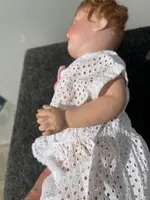 Poupée avec une tête en biscuit, des yeux mobiles et un corps en papier mâché. Signée Heuback, Allemagne.