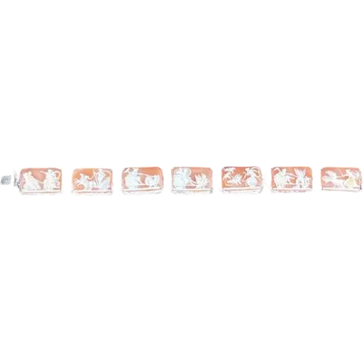Openwork silver bracelet featuring plant motifs and seven cameos depicting neoclassical scenes.