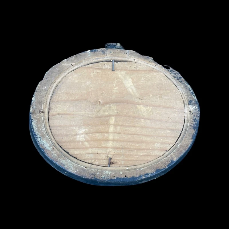 Oval alabaster painting depicting the Virgin Mary with angels and figures.