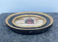 Oval alabaster painting depicting the Virgin Mary with angels and figures.