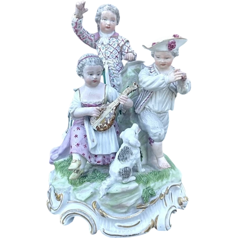 A porcelain figurine set depicting children playing musical instruments. Meissen.
