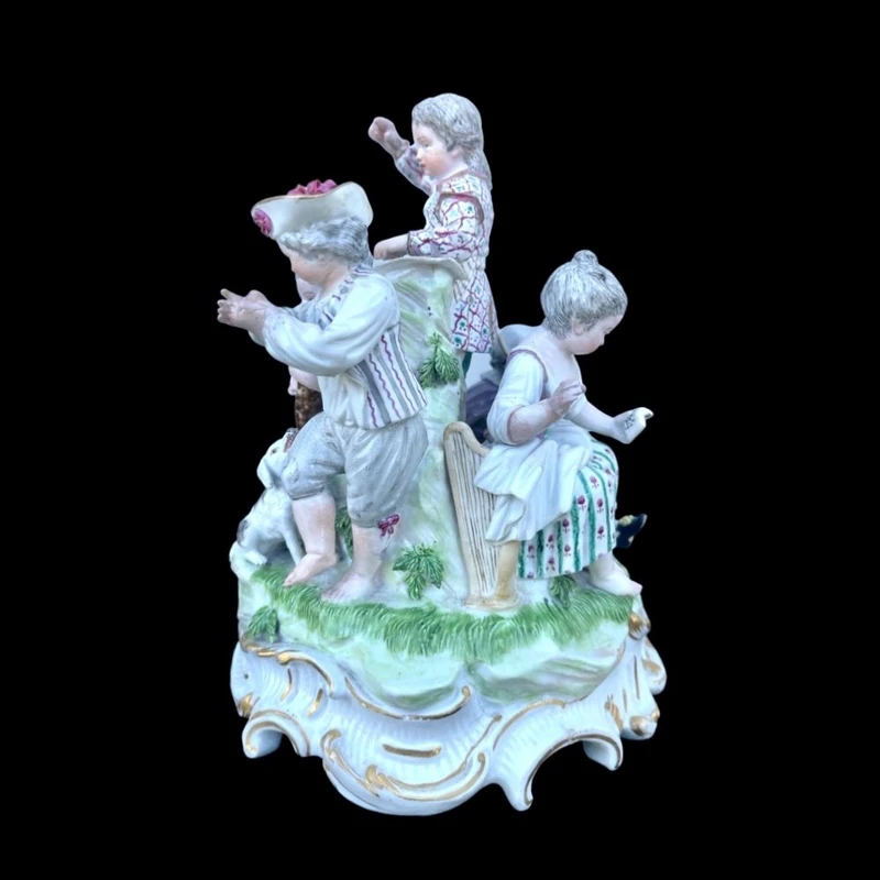 A porcelain figurine set depicting children playing musical instruments. Meissen.