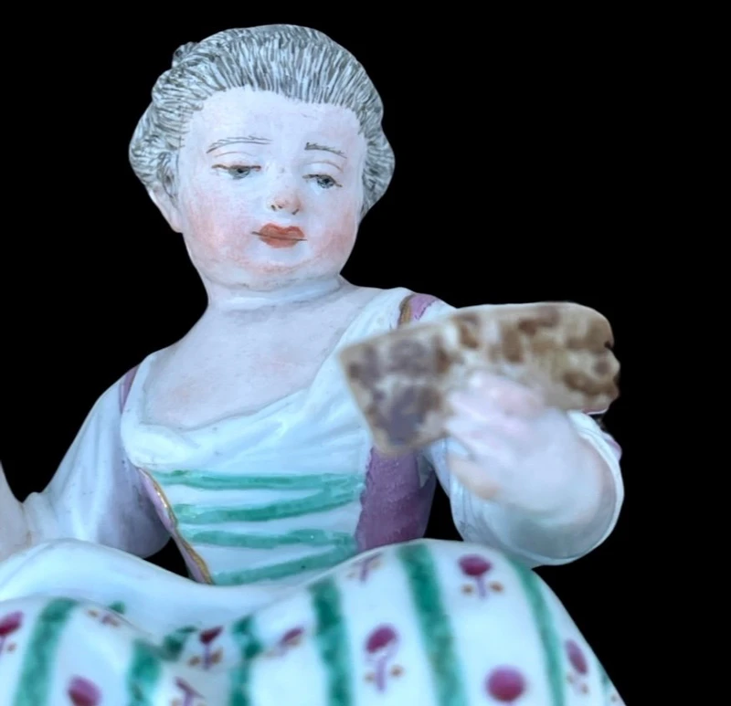 A porcelain figurine set depicting children playing musical instruments. Meissen.