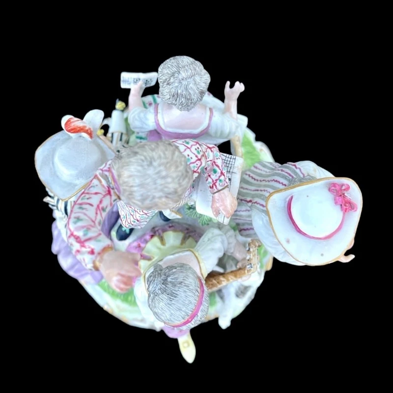 A porcelain figurine set depicting children playing musical instruments. Meissen.