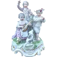 A porcelain figurine set depicting children playing musical instruments. Meissen.