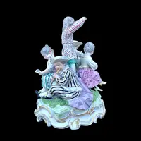 A porcelain figurine set depicting children playing musical instruments. Meissen.