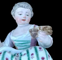 A porcelain figurine set depicting children playing musical instruments. Meissen.