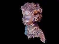 Pair of carved wooden cherubs with a marbled finish. Liguria.