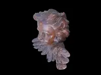 Pair of carved wooden cherubs with a marbled finish. Liguria.