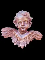 Pair of carved wooden cherubs with a marbled finish. Liguria.