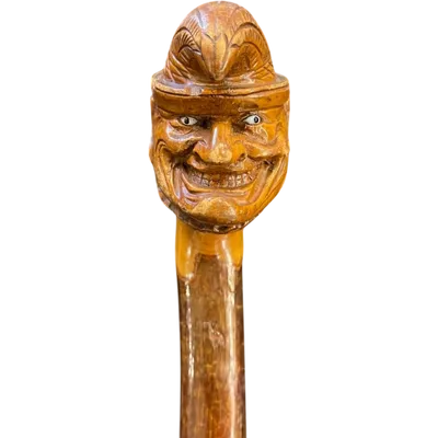 A single-piece birch wood walking stick featuring a joker.