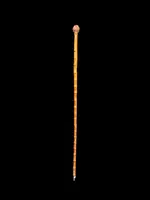 Cane with a curozo seed knob depicting a grotesque face. Glass eyes