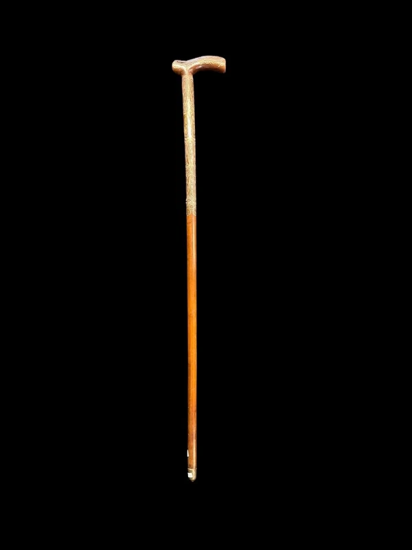 Rosewood walking stick with a Tau-shaped handle featuring geometric decoration in small silver studs