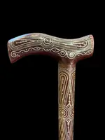 Rosewood walking stick with a Tau-shaped handle featuring geometric decoration in small silver studs