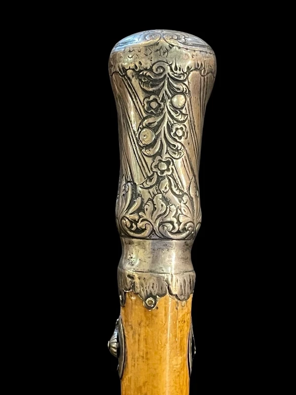 "Compagnon" ceremonial cane in silver with stylized floral and geometric motifs.