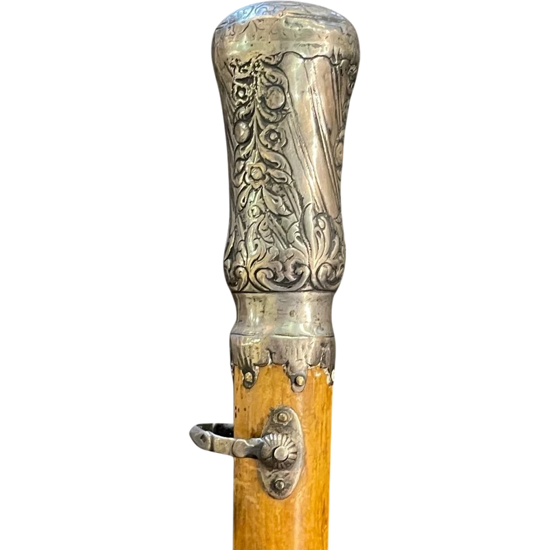 "Compagnon" ceremonial cane in silver with stylized floral and geometric motifs.