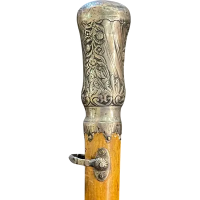 "Compagnon" ceremonial cane in silver with stylized floral and geometric motifs.