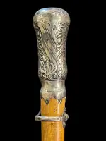 "Compagnon" ceremonial cane in silver with stylized floral and geometric motifs.