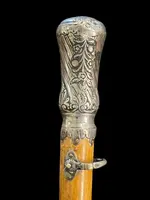 "Compagnon" ceremonial cane in silver with stylized floral and geometric motifs.