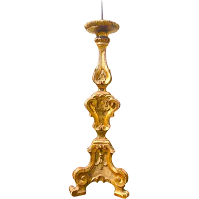 A carved and gilded wooden candlestick featuring rocaille and stylized plant motifs.