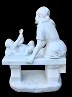 A sculpture in white Carrara marble depicting a mother holding cherries and her child.