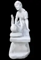 A sculpture in white Carrara marble depicting a mother holding cherries and her child.
