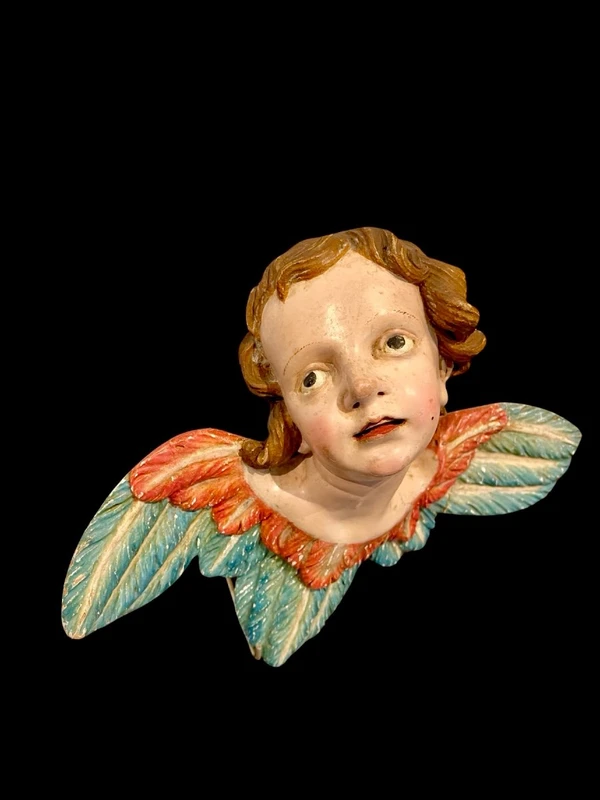 Carved and painted wooden cherub. Liguria.