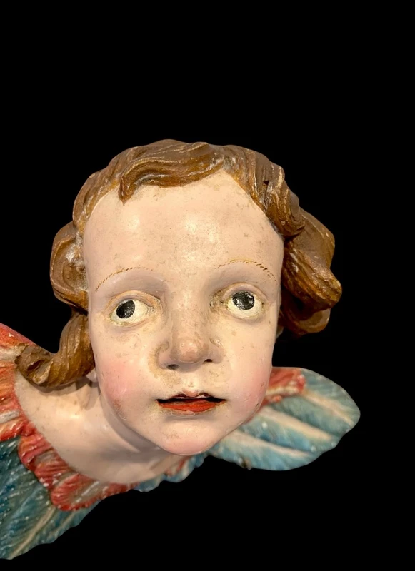 Carved and painted wooden cherub. Liguria.