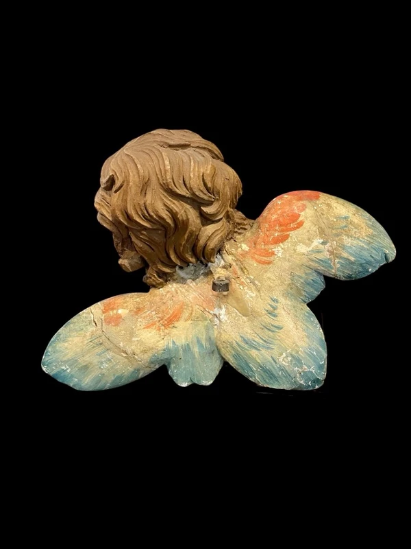 Carved and painted wooden cherub. Liguria.