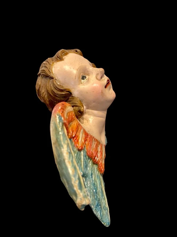 Carved and painted wooden cherub. Liguria.