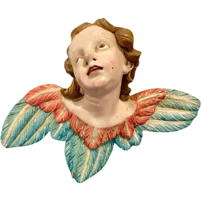 Carved and painted wooden cherub. Liguria.