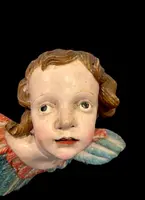 Carved and painted wooden cherub. Liguria.