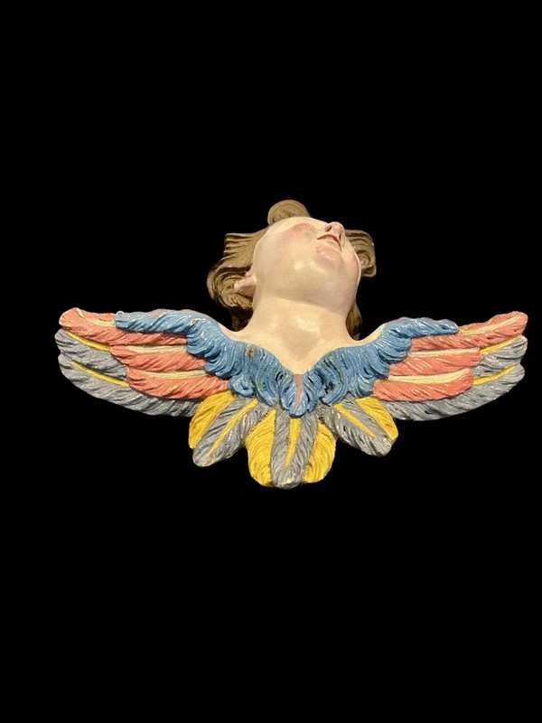 Carved and painted wooden cherub. Liguria.