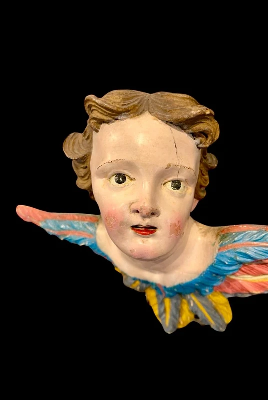 Carved and painted wooden cherub. Liguria.