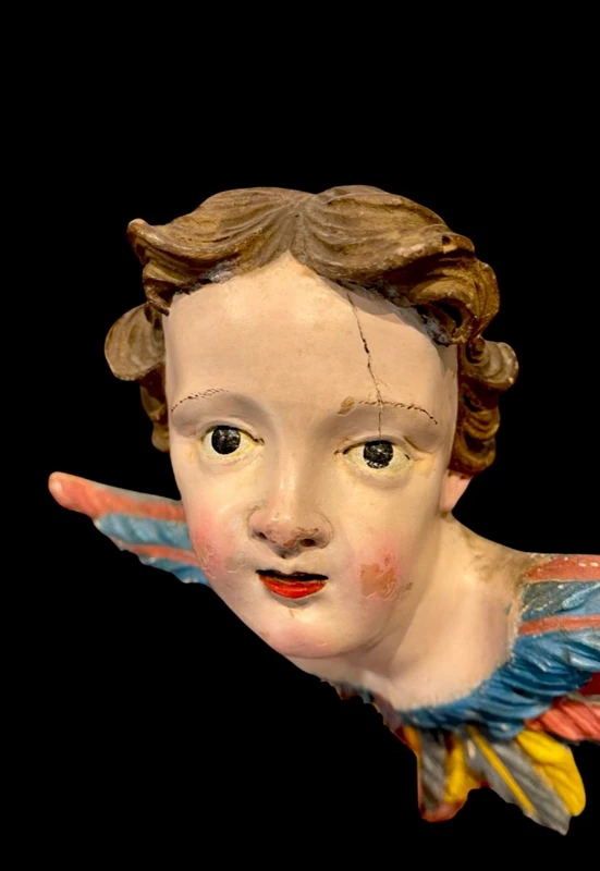 Carved and painted wooden cherub. Liguria.