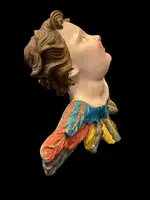 Carved and painted wooden cherub. Liguria.