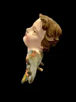 Carved and painted wooden cherub. Liguria.