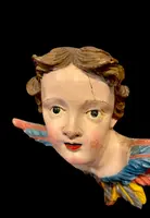 Carved and painted wooden cherub. Liguria.