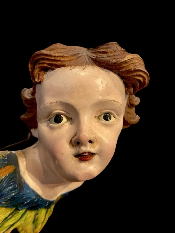 Carved and painted wooden cherub. Liguria.