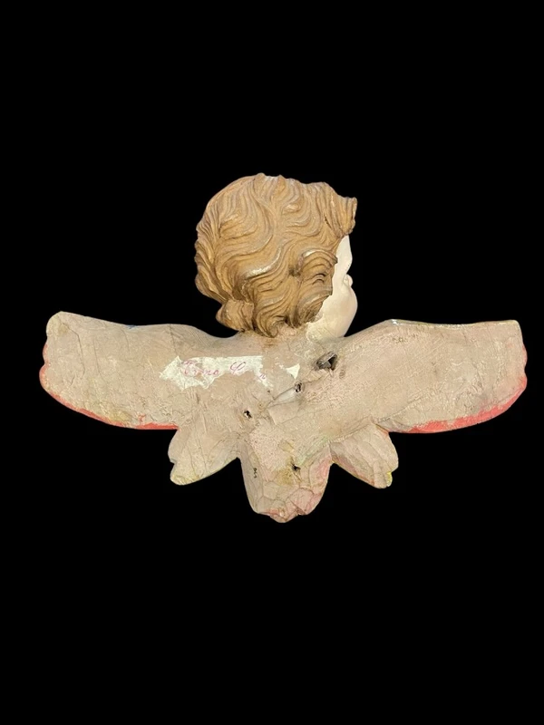 Carved and painted wooden cherub. Liguria.