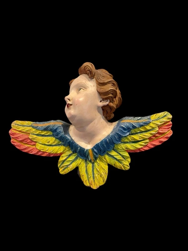 Carved and painted wooden cherub. Liguria.