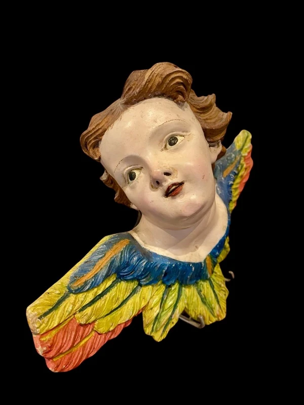 Carved and painted wooden cherub. Liguria.
