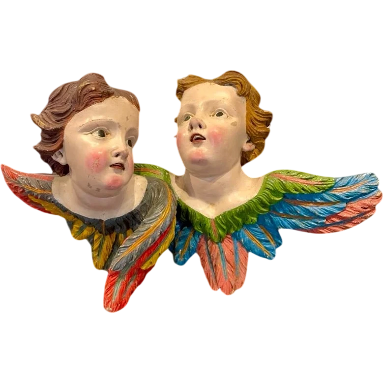 Coppia di Angeli-cherubini in legno intagliato e dipinto. Liguria.