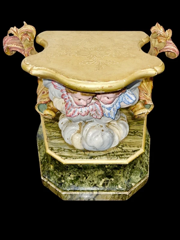 Carved and painted wooden statue base.